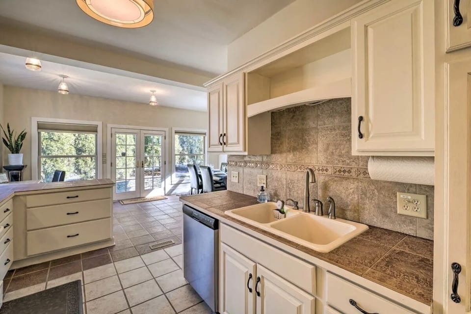 Chef's Kitchen w/ pots, pans, baking dishes, utensils, spices, & oils. 