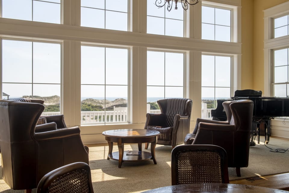 Gathering Space — The Fitzgerald Grand Living Room with Soaring Ceilings & Panoramic Ocean Views | Seats 40+ for Rehearsal Dinners, Corporate Sessions & Receptions