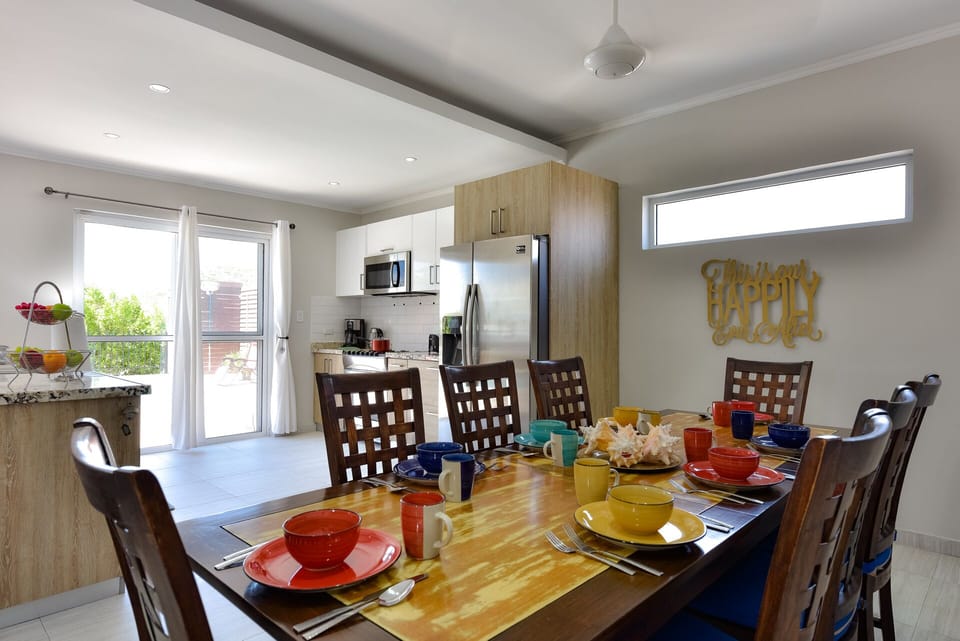 Dining room into kitchen. Dining room table inside seats 8 people.