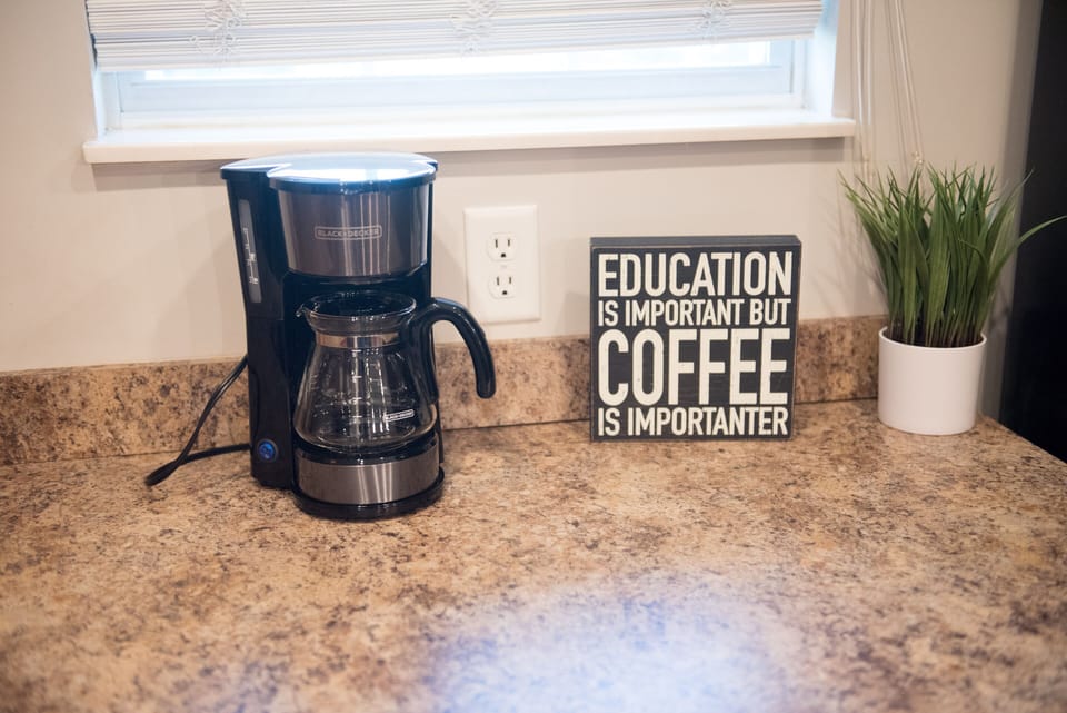 Coffee maker and other small appliances are available in the kitchen.