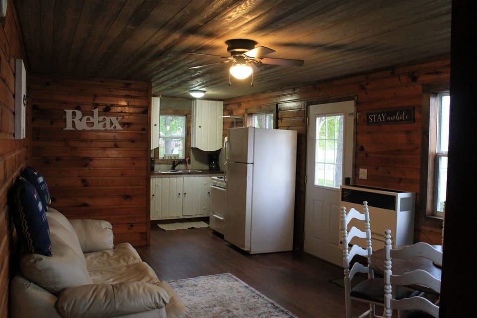 Living room, dining room, kitchen - direct lake views from all windows.