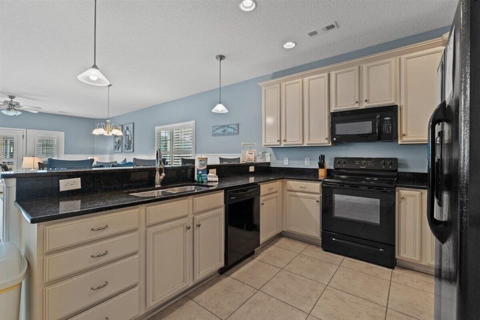Your spacious kitchen features granite countertops, full appliances, and flows beautifully into the living area for effortless entertaining.