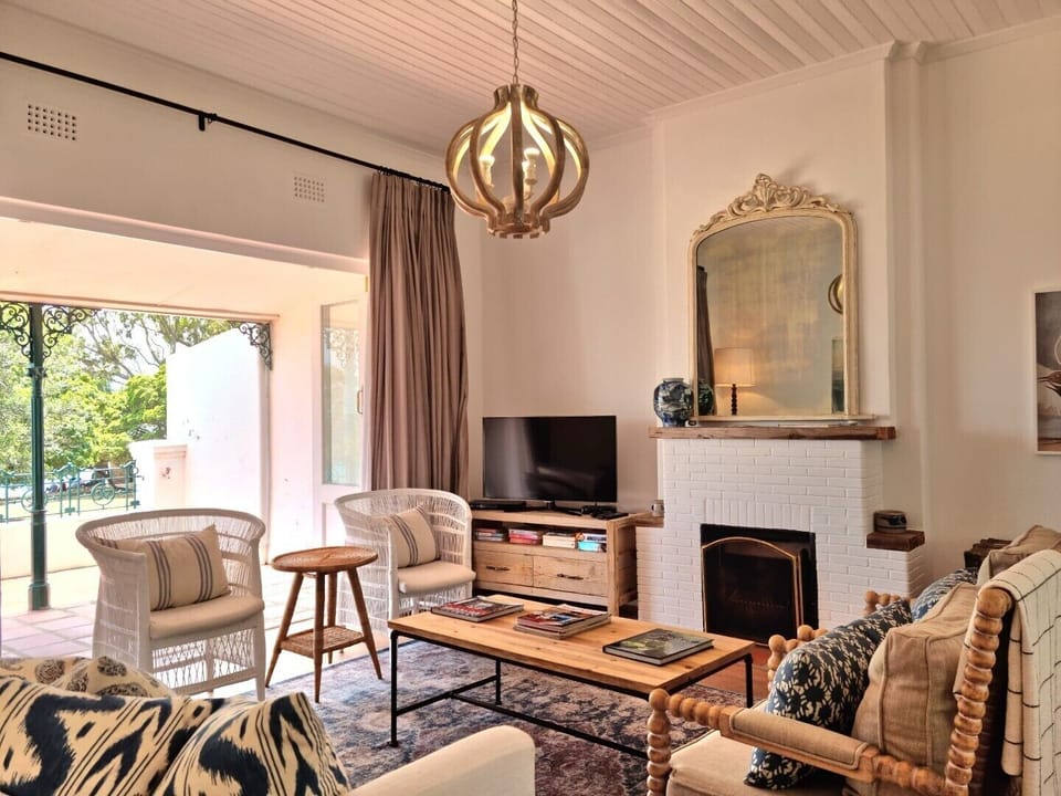 The living room with a fireplace and tv