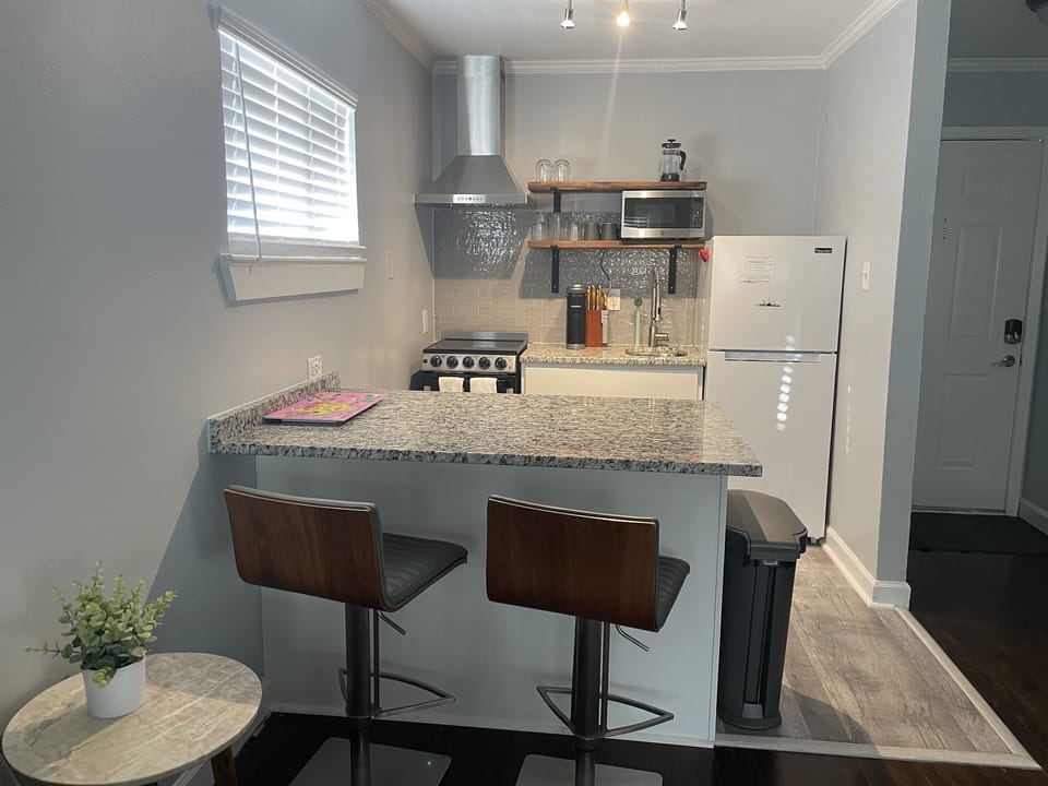 Fully stocked kitchen - equipped with Keurig, coffee pods, French Press, microwave, toaster oven, blender, Brita water pitcher and full set of cookware and dinnerware.
