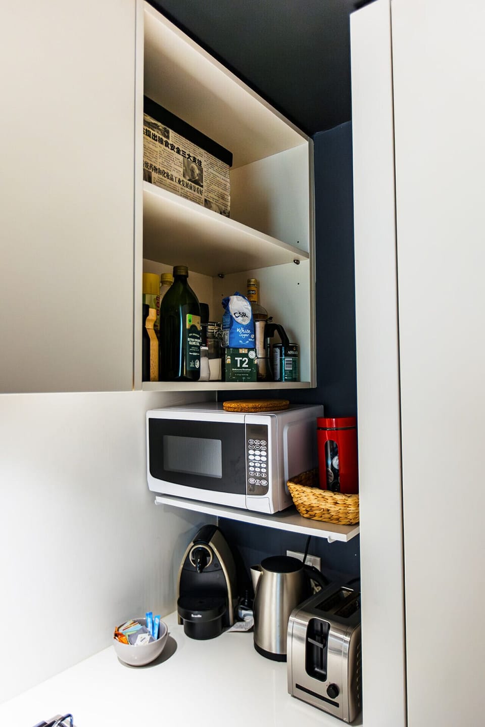 Premium appliances including a microwave, stove, toaster, coffee machine, and kettle provide everything you need to prepare delicious meals and enjoy a comfortable, hassle-free stay.