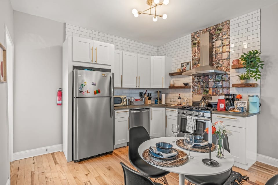 Open-concept design connects dining table and kitchen, ideal for sharing meals and conversations.