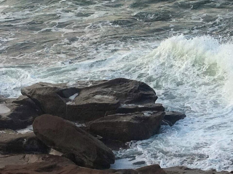 Fabulous views on Atlantic water hitting large rocks 