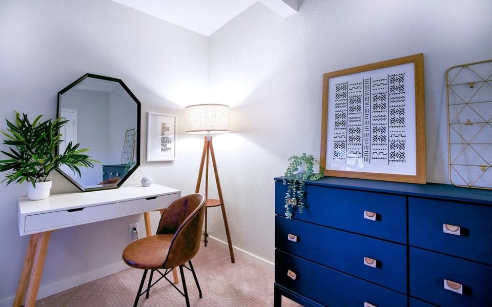 Full-sized dresser and a desk for working professionals