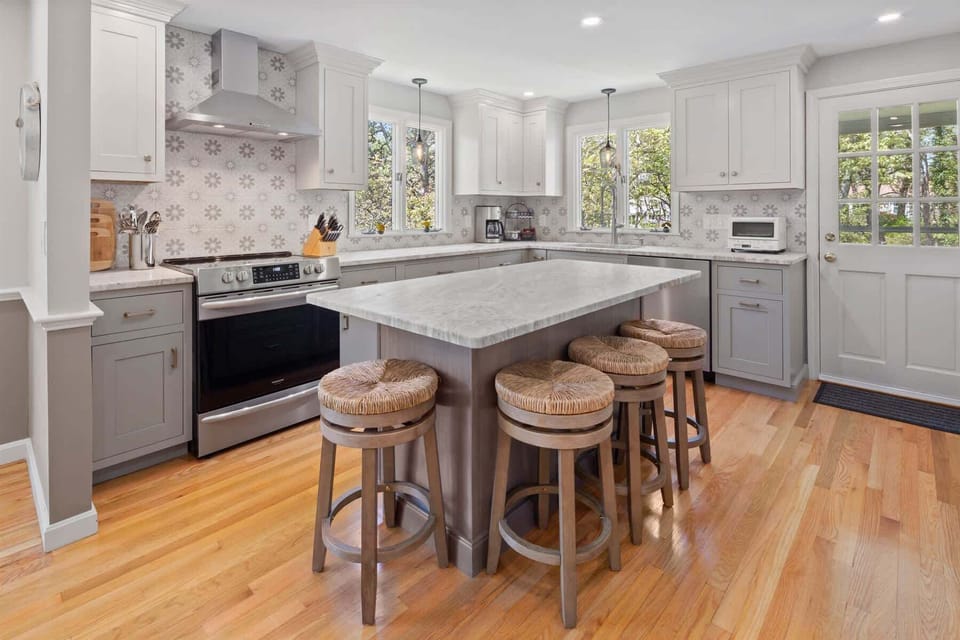 Well-equipped kitchen and breakfast bar with seating for four