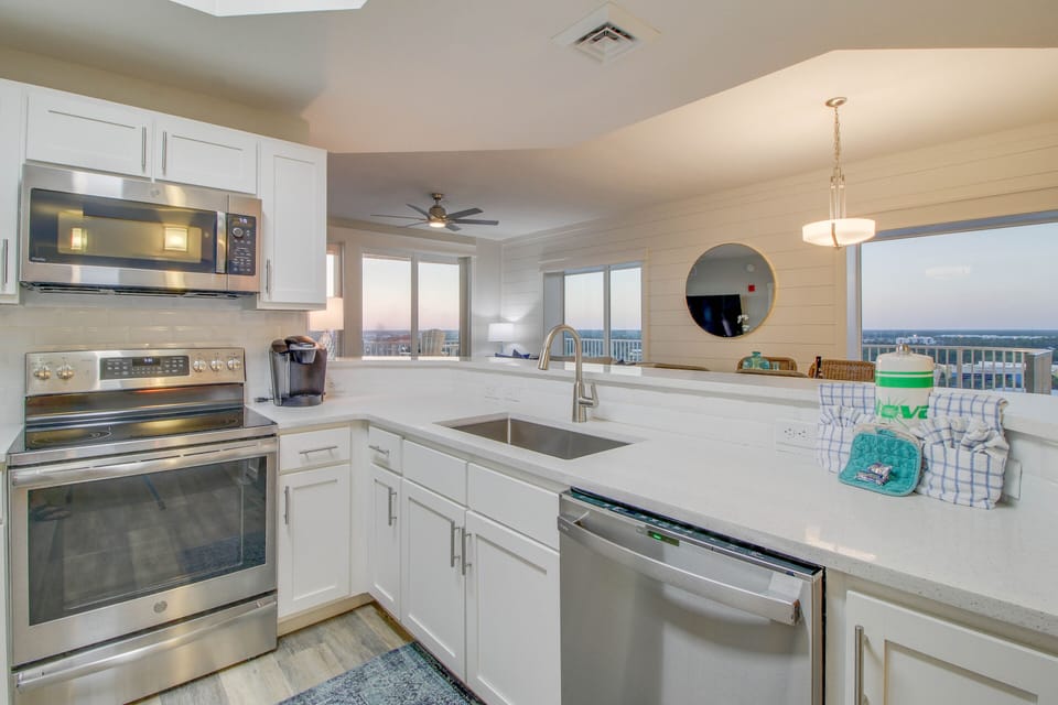 Beautiful kitchen fully stocked with coffee maker + blender + toaster + cooking & eating utensils! New stainless steel appliances + full-size fridge & freezer!