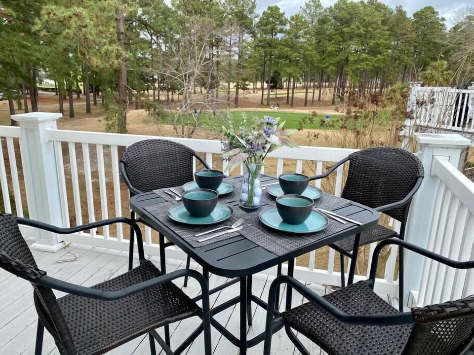Enjoy a morning cup of coffee or a sunset dinner on the patio over looking the green.