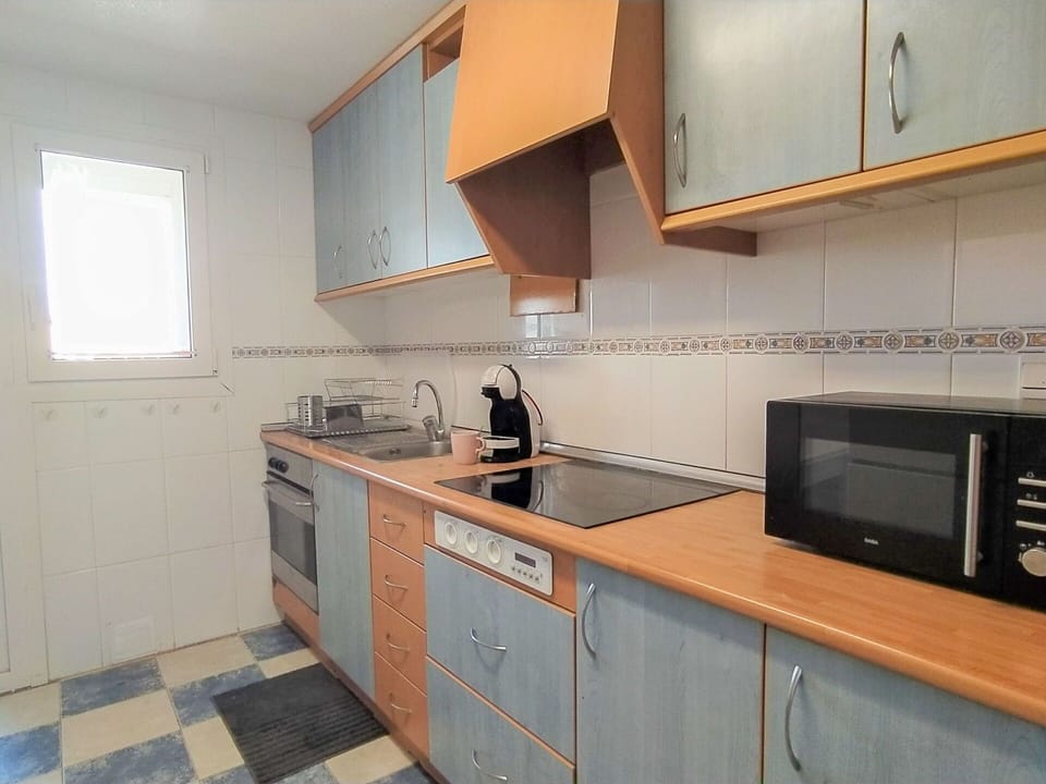 Countertop, Cabinetry, Property, Furniture, Sink, Kitchen, Kitchen Stove, Wood, Window, Kitchen Appliance