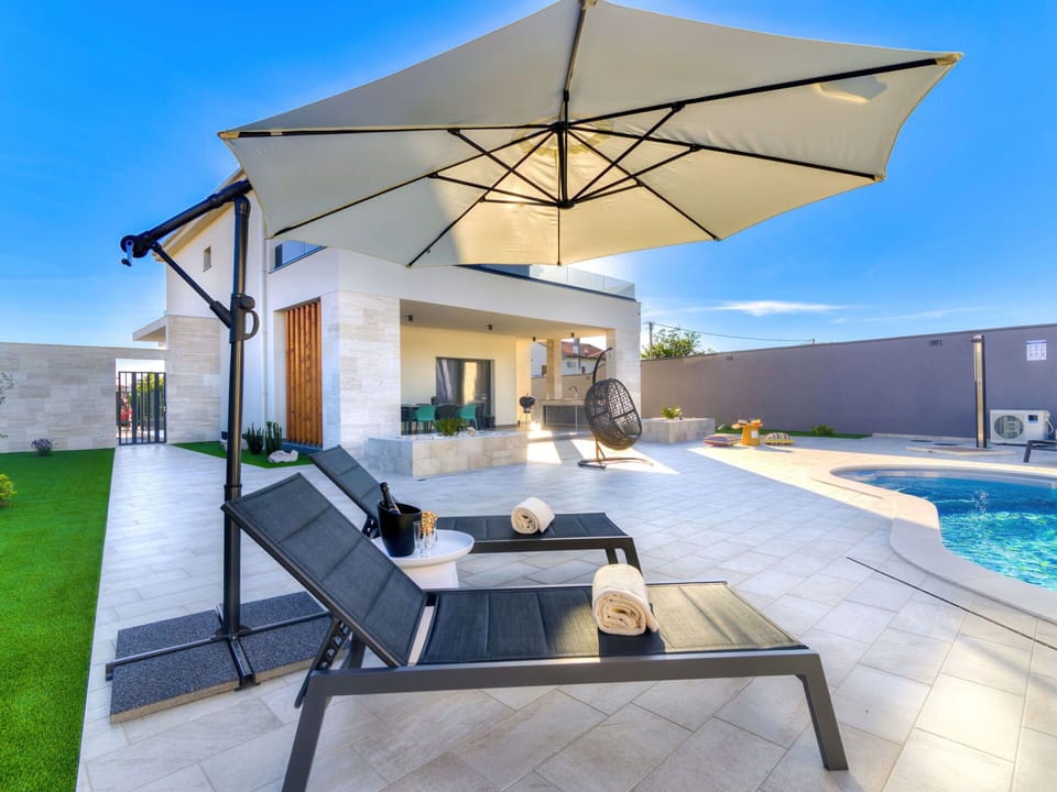 Water, Sky, Property, Plant, Azure, Swimming Pool, Tree, Leisure, Shade, Building