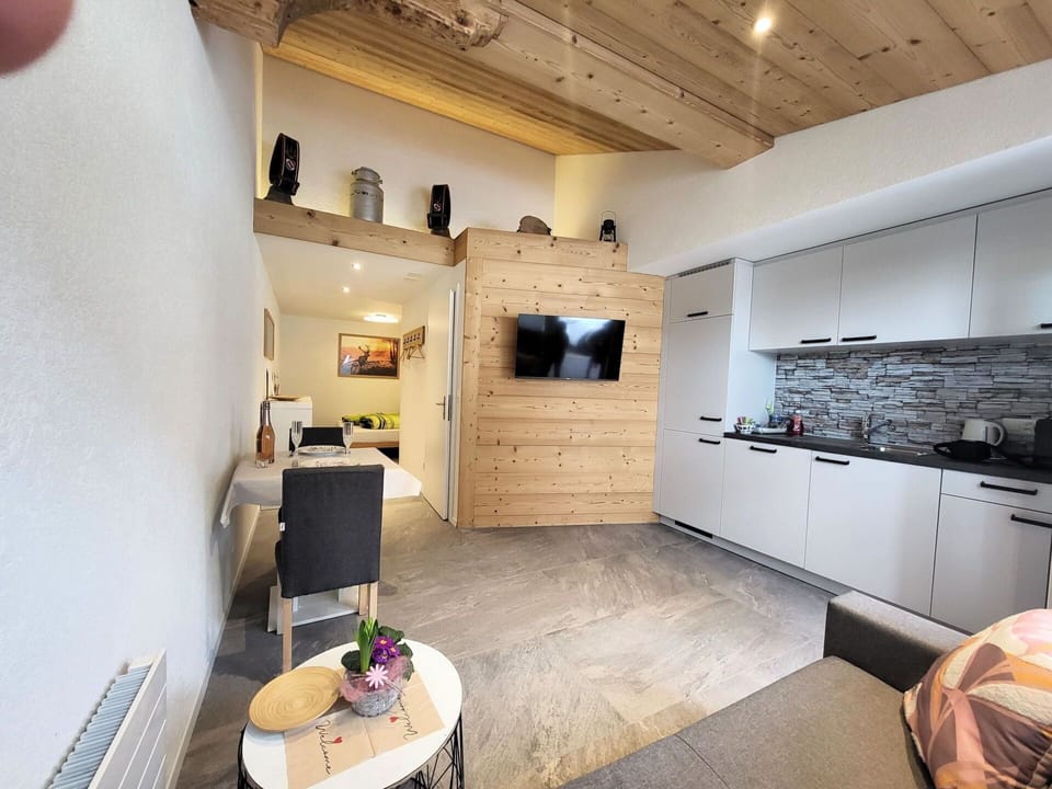 Property, Furniture, Table, Cabinetry, Interior Design, Wood, Living Room, Chair, Flooring, Floor