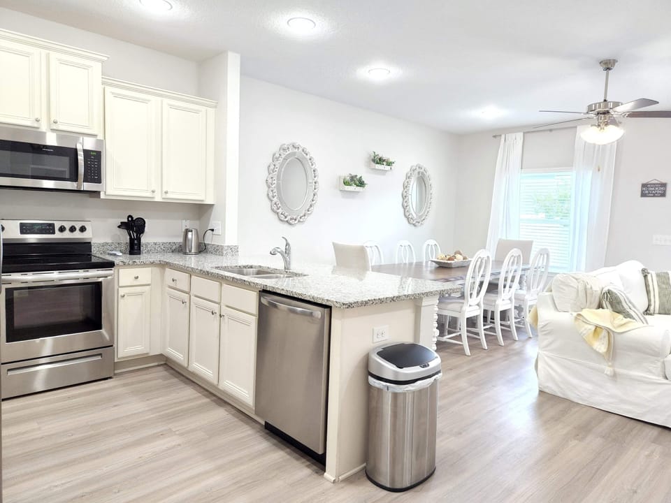 Large open kitchen, dining and living room space.