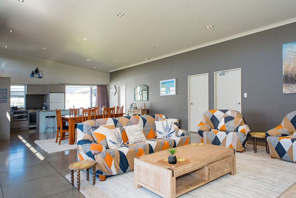 Large open plan living space with high ceilings make this house always bright. 