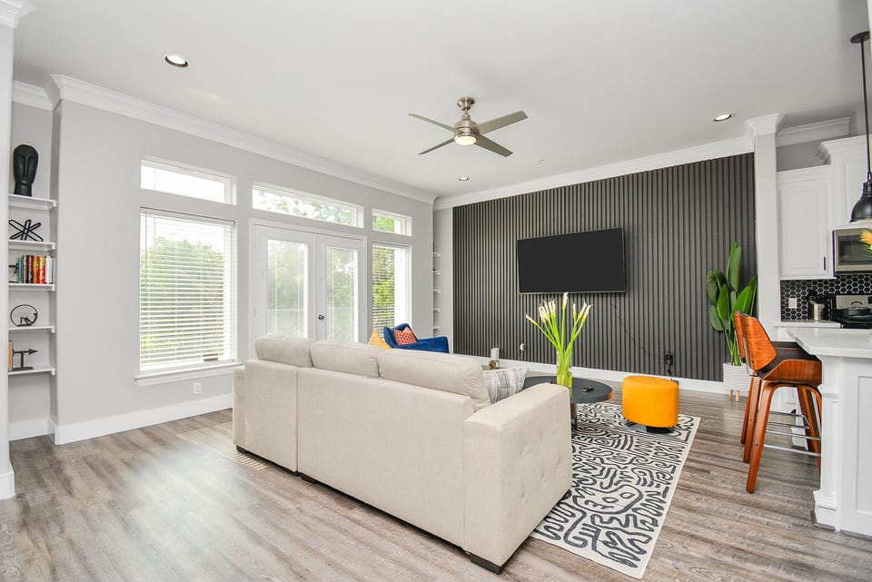 Relax in this super contemporary living room and enjoy the 70" smart TV