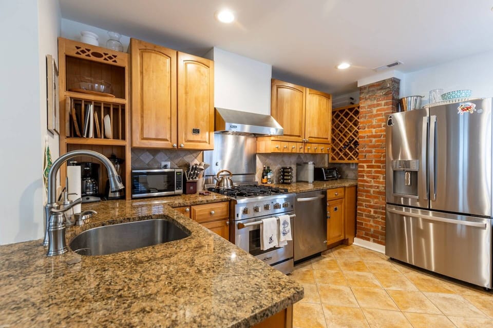 The kitchen has all stainless steel appliances, including the new refrigerator with water dispenser and ice maker.