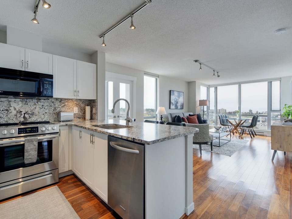 Gourmet Kitchen with Open Concept Living and Dining Area