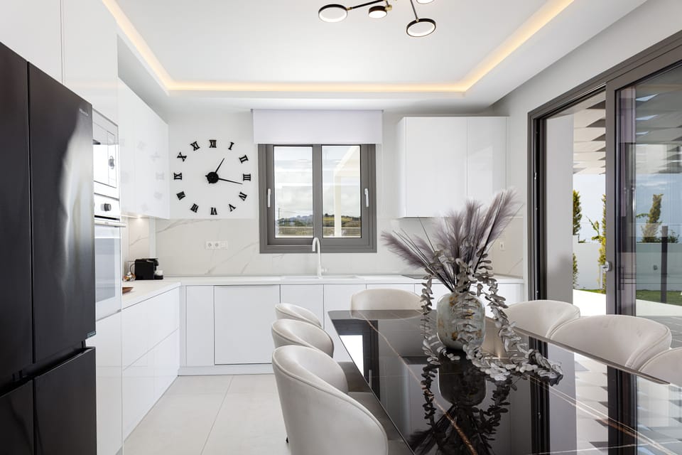 The indoor open plan kitchen and dining area await to inspire your culinary self