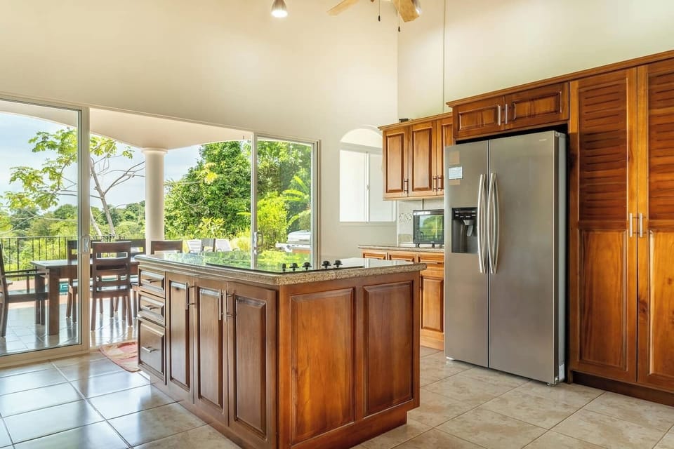 A bright and airy kitchen, combining modern design with a cozy, welcoming atmosphere.