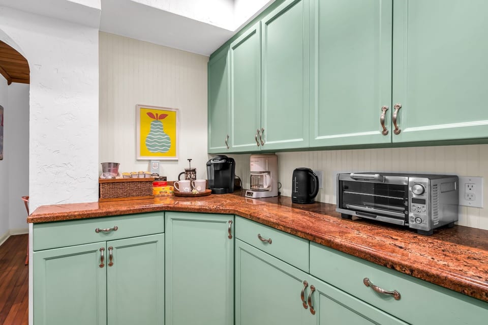 The Kitchen is brightly painted and a pleasure to cook in. It has everything you need to create a fabulous home-cooked meal for family or friends. There is a gas range, stainless steel stove and oven, Keurig, kettle, and blender.