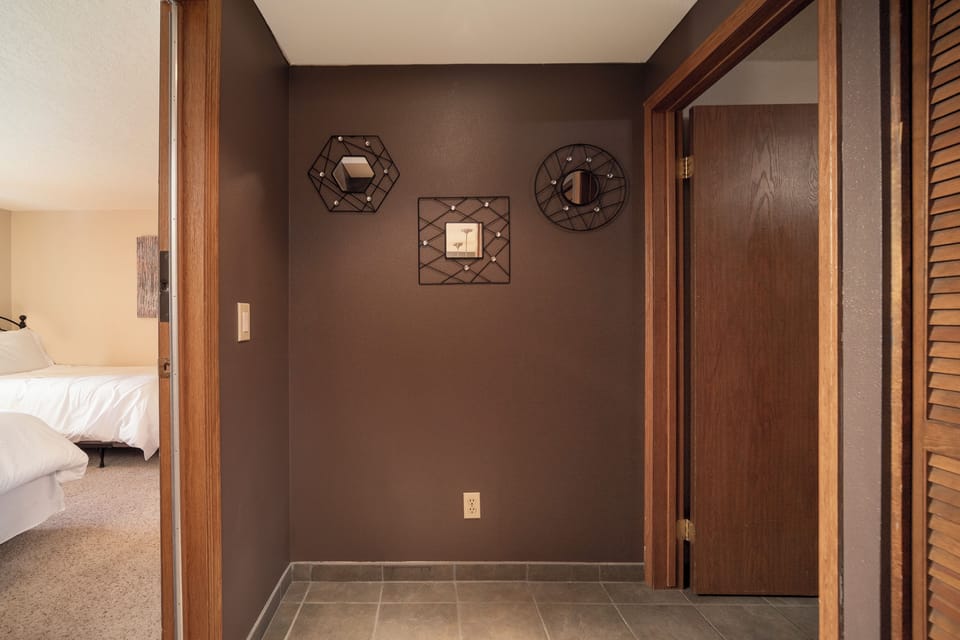 Step into your private entryway with elegant decor and warm wood accents welcoming you home after each adventure.