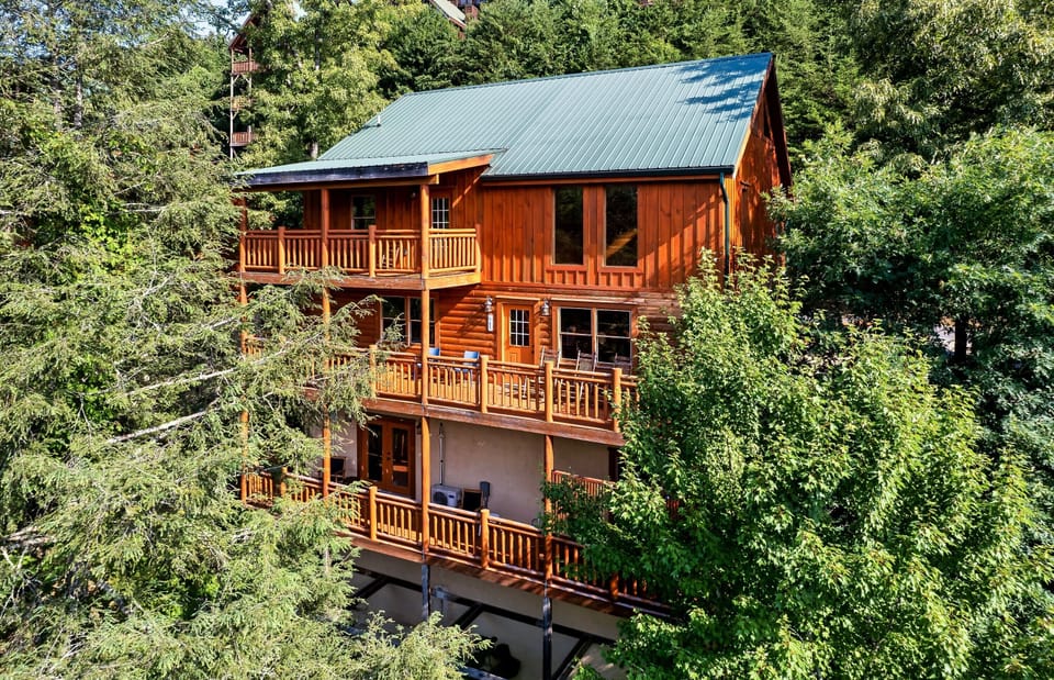 Three stories, five bedrooms, room for 24. The Parkway is 5 minutes away. The quiet stays up here.