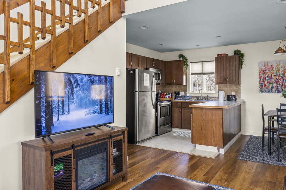 Enjoy the view of kitchen activities while hanging out on the couch.