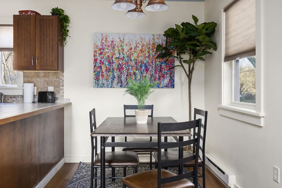 The dining room is next to the kitchen, ready home cooked meals.
