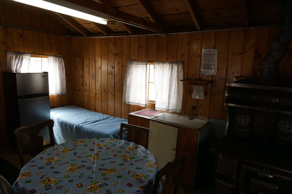 Cabin 6 has a full size fridge and a table for five.