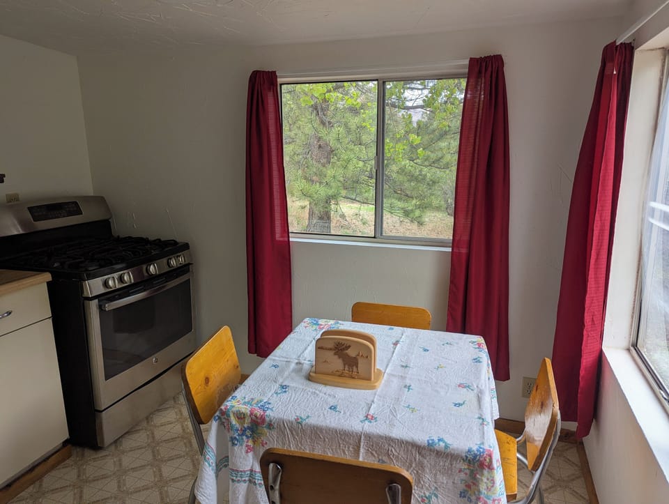 Cabin 11's quaint kitchen has a table for four with amazing views.