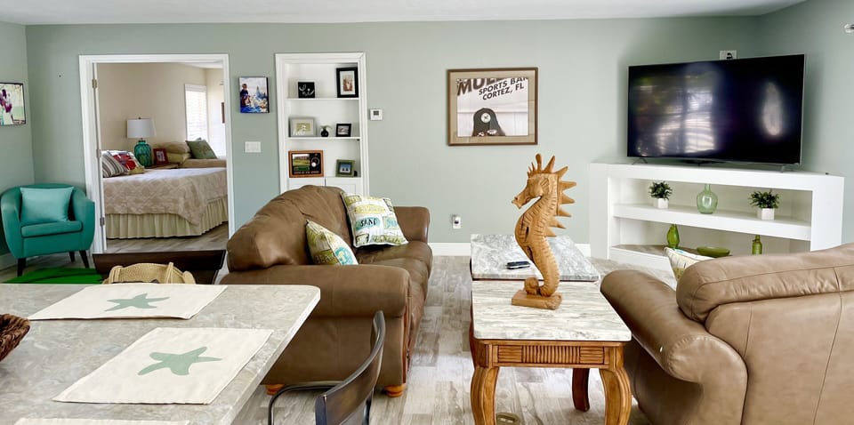 Large open living/dining/kitchen area. 