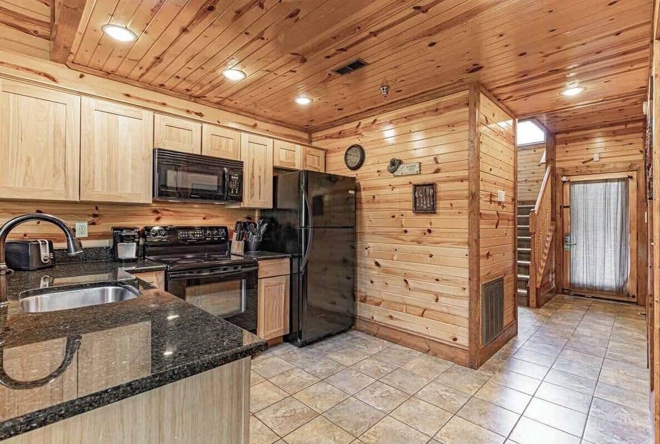 You'll love our kitchen - complete with all the appliances you need for your stay - a fridge, freezer, oven, range top, microwave, toaster, and coffee maker!