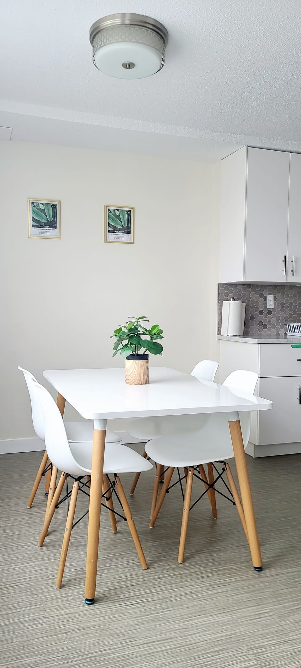 The dining room opens up to the living space right next to the balcony door.