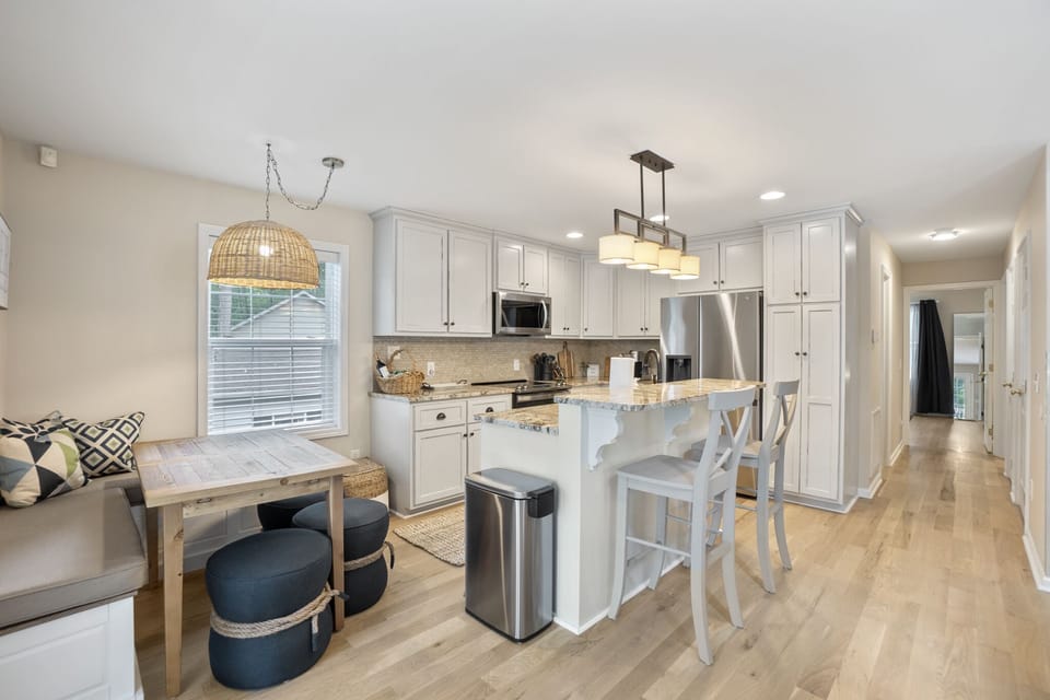Fully stocked kitchen with island seating for 2 and breakfast nook with seating for 5.
