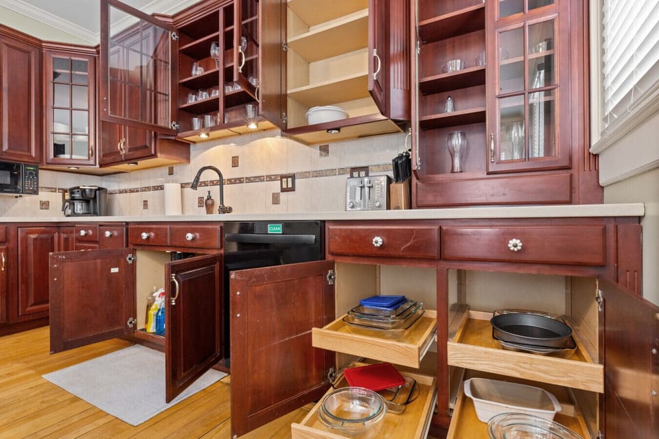 Kitchen stocked with dinnerware and cooking essentials