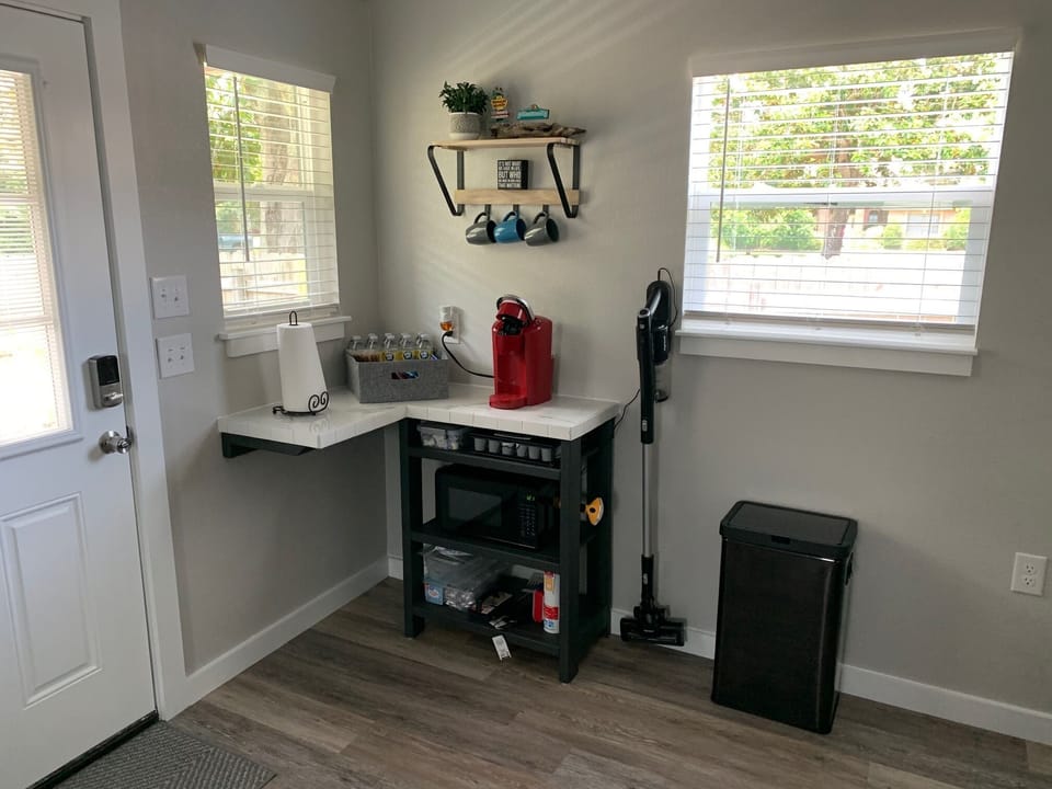 Keurig w/ coffee, tea, creamer, sugar. Microwave, paper plates, plastic utensil