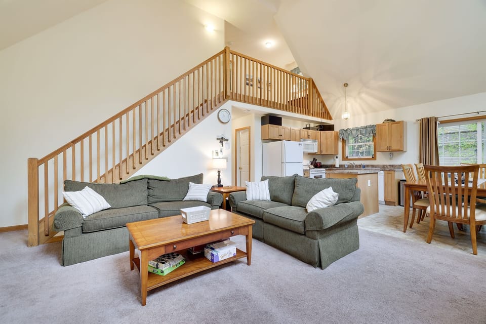 Living room with gas fireplace, comfortable couches, TV and coffee table