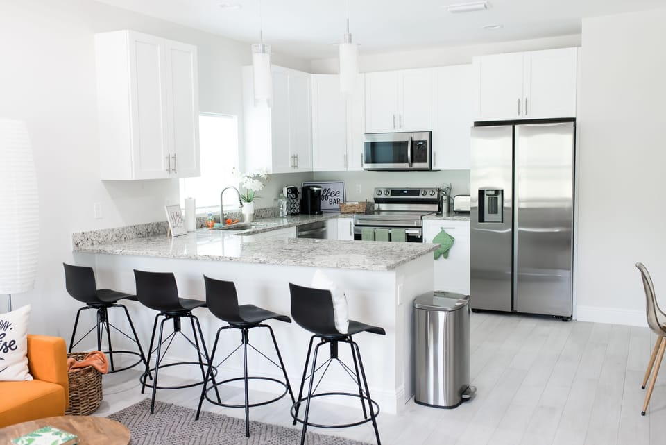 Cook a meal in our open kitchen w/counter seating , coffee bar and cookware.