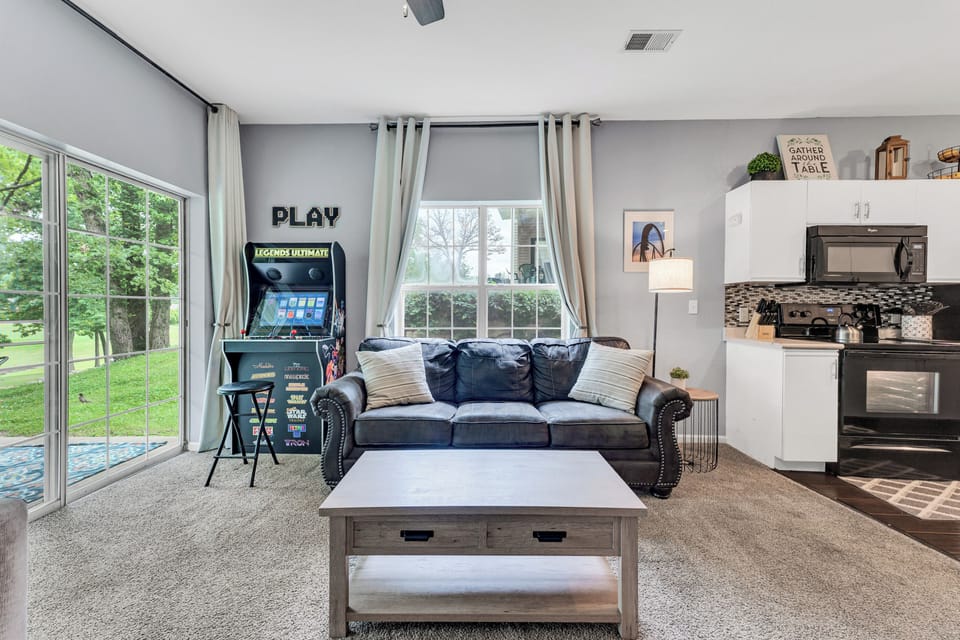 Enjoy the natural light in the living room while you enjoy the arcade machine.