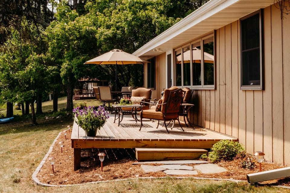Lakeside deck with plenty of seating to enjoy the panoramic lake view
