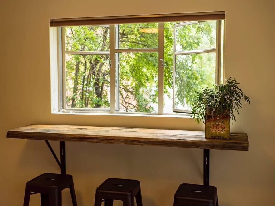 Enjoy a bite or glass of wine at the handcrafted bar, made from salvaged Tasmanian bridge timbers—charm with a story.
