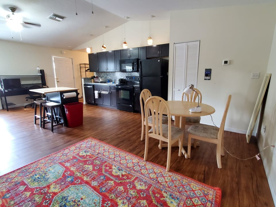 Full kitchen, kitchen island, dining table. Desk with monitor for your laptop.