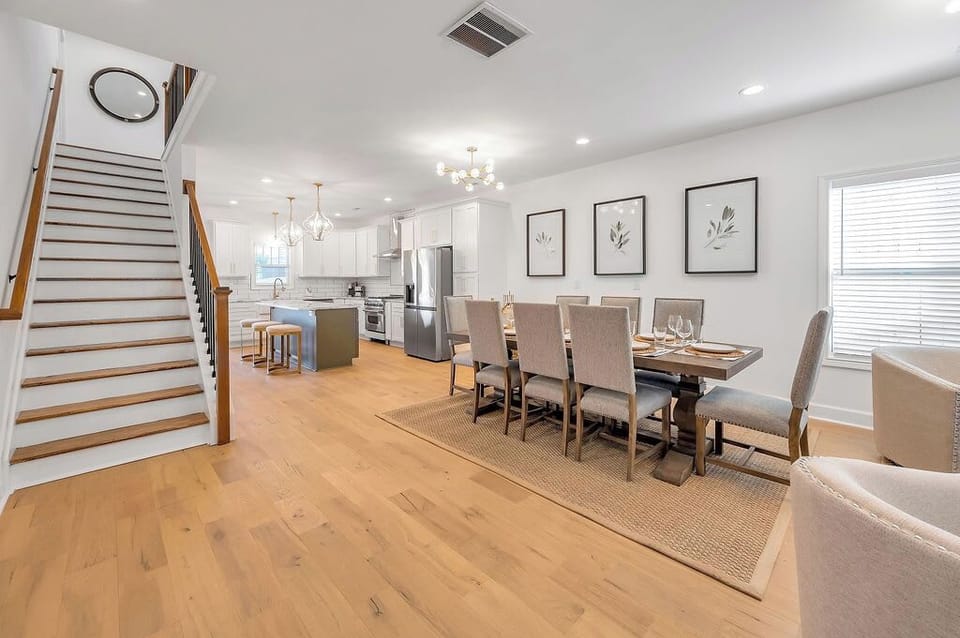 Take the
stairs down and land
right in the middle of
it all — dining table
on one side, kitchen
on the other, everyone within
earshot.

 