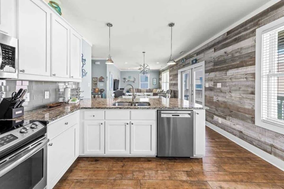 The open-concept kitchen overlooks both the dining area and living room for easy gathering.