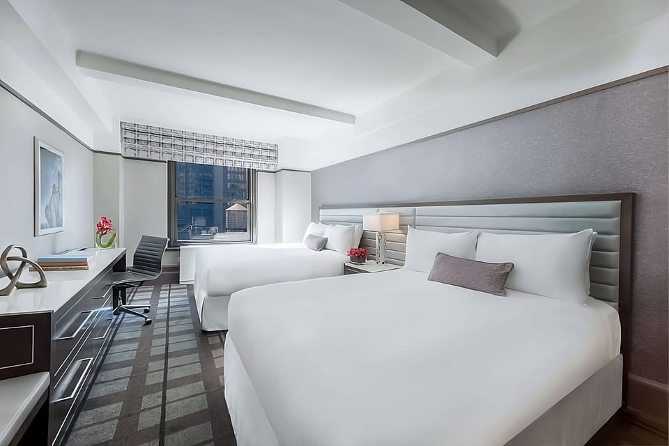 Unwind in a bright double-queen room with city views.