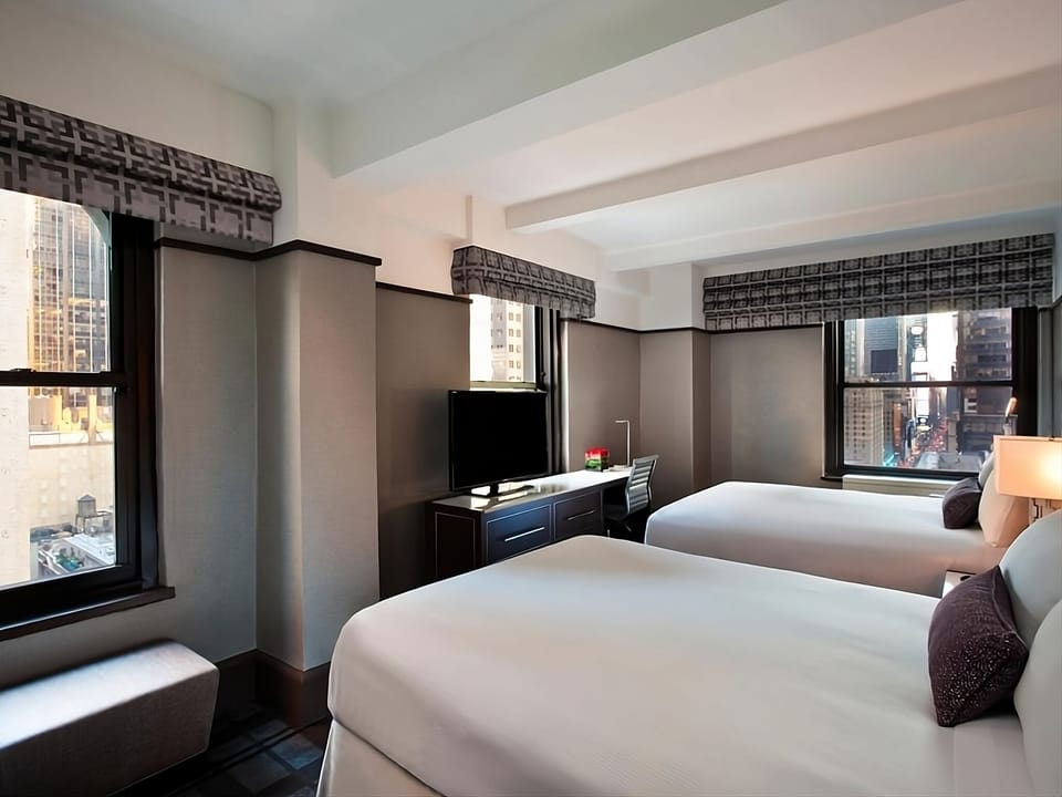 Enjoy morning light and extra space around two comfortable beds.