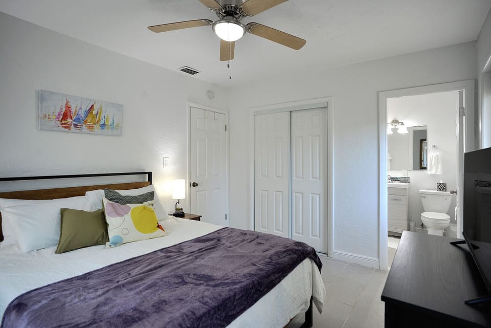 Bedroom #2. Queen size bed with a full size dresser and closet.