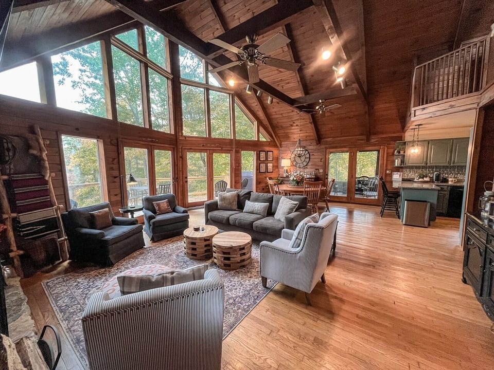 comfortable living room couch and chairs with an ottoman and coffee table